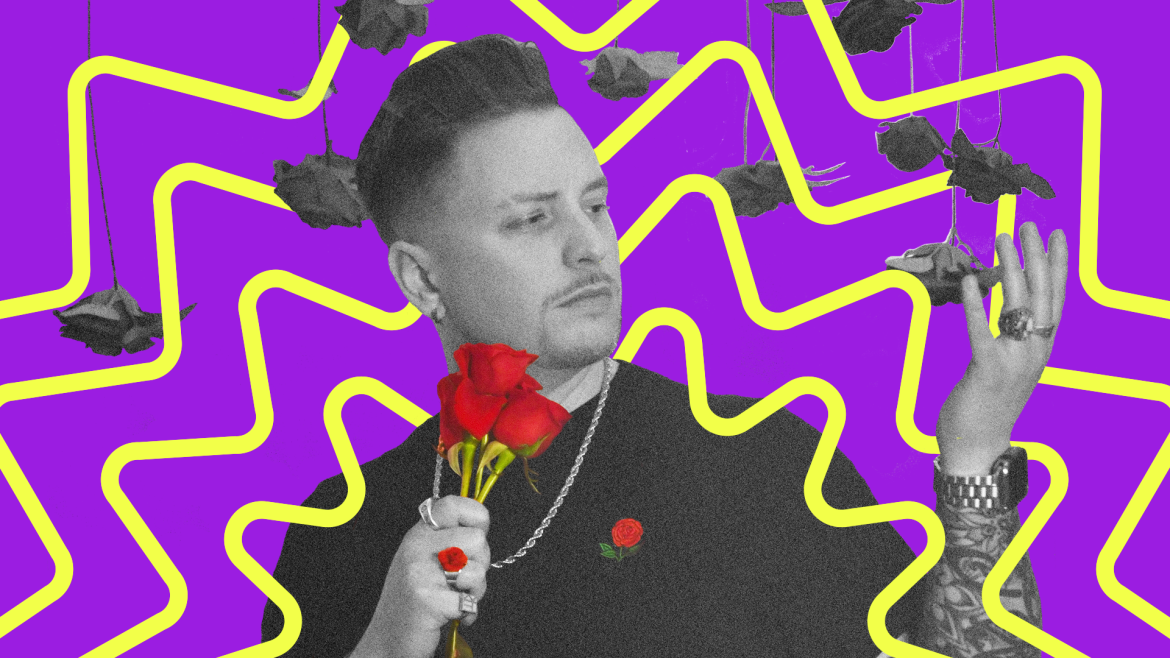 Grayson rose, mostly in black and white, holds a bouquet of red roses, with a red rose ring and a red rose print on his shirt, while holding a hand up to touch black & white roses